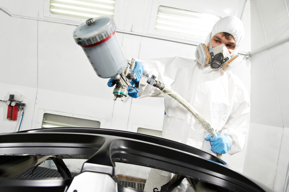 auto mechanic worker painting car